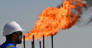 An employee of Basra Oil Company, inspects the Nahr Bin Umar Oil and Gas Field on the outskirts of the southern city of Basra, Iraq, April 29, 2026. (AFP Photo)