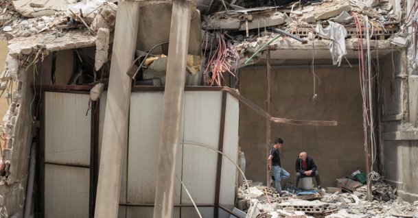People shelter inside a destroyed building, amid a temporary cease-fire between Lebanon and Israel, Tyre, southern Lebanon, April 28, 2026. (Reuters Photo)