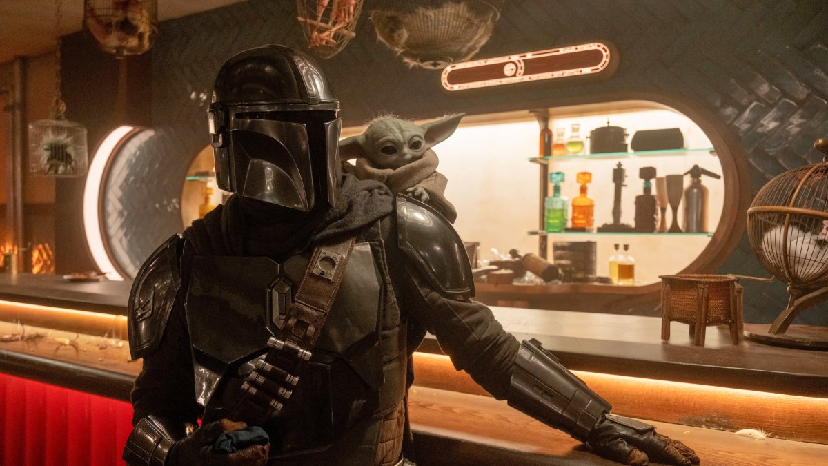 This image released by Disney shows the Mandalorian, portrayed by Pedro Pascal, (L) and Grogu in a scene from Lucasfilm's "The Mandalorian and Grogu." (AP Photo)