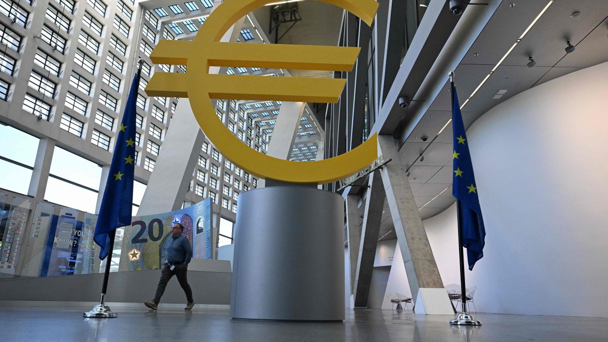 A man walks past a Euro logo at the visitor center of the European Central Bank (ECB), Frankfurt am Main, western Germany, April 30, 2026. (AFP Photo)