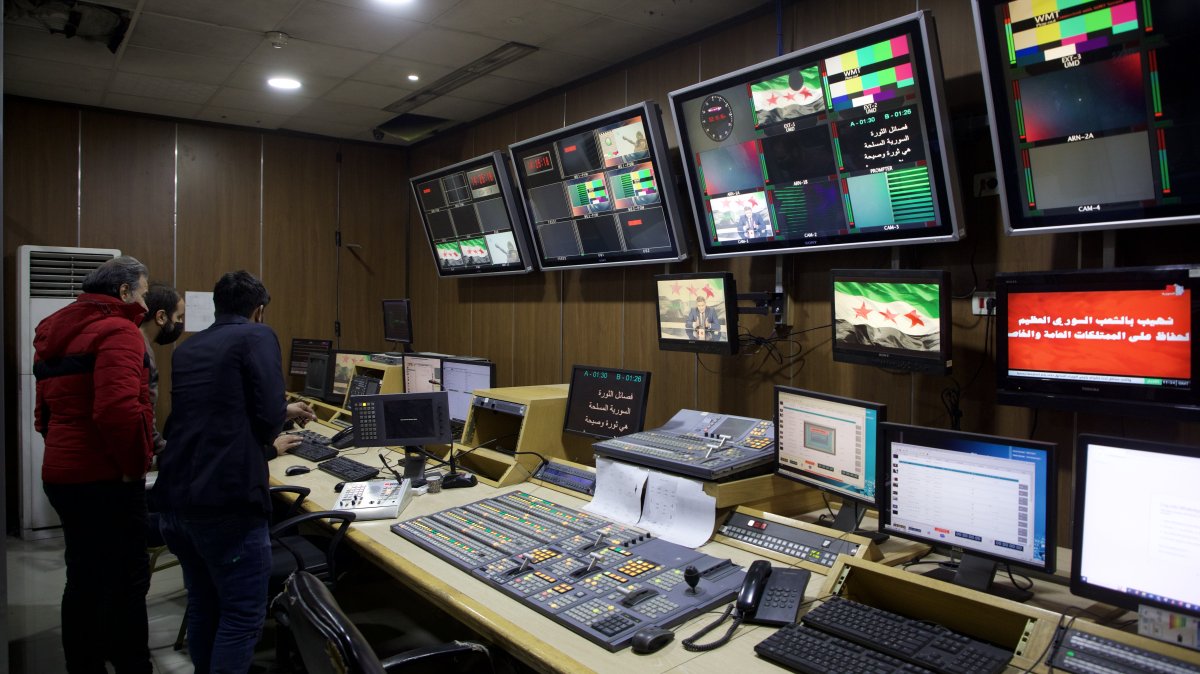 People are seen inside the broadcast studio of the General Organization of Radio and TV Syria, in Damascus, Syria, Dec. 8, 2024. (Getty Images)