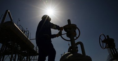 An employee of Basra Oil Company works at the Nahr Bin Umar Oil and Gas Field on the outskirts of Basra, Iraq, April 29, 2026. (AFP Photo)