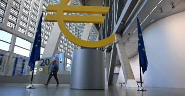 A man walks past a Euro logo at the visitor center of the European Central Bank (ECB), Frankfurt am Main, western Germany, April 30, 2026. (AFP Photo)