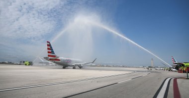 American Airlines Flight 3599, operating from Miami International Airport to Caracas, Venezuela, receives an honor guard water salute from Miami-Dade Fire Rescue as it departs on a flight to Venezuela at Miami International Airport in Miami, Florida, U.S., April 30, 2026. (AFP Photo)
