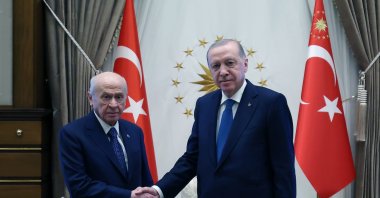 President Recep Tayyip Erdoğan and MHP Chairman Devlet Bahçeli shake hands as they meet at the Presidential Complex in Ankara, April 30, 2026. (DHA Photo)