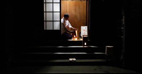 A devotee prepares lanterns to guide the way for the evening procession marking the start of a two-day Hinode Sai, or Sunrise festival, at Musashi Mitake Shrine,Tokyo, Japan, April 28, 2026. (AFP Photo)
