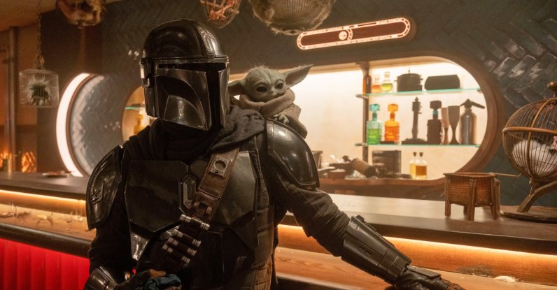 This image released by Disney shows the Mandalorian, portrayed by Pedro Pascal, (L) and Grogu in a scene from Lucasfilm's "The Mandalorian and Grogu." (AP Photo)