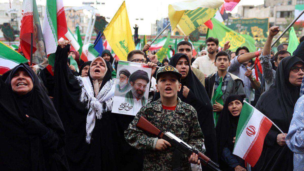 A young enthusiast dressed in military attire holds a mock rifle during a rally to show solidarity and support for the Iranian supreme leader, Ayatollah Mojataba Khamenei, Tehran, Iran, April 29, 2026. (AFP Photo)