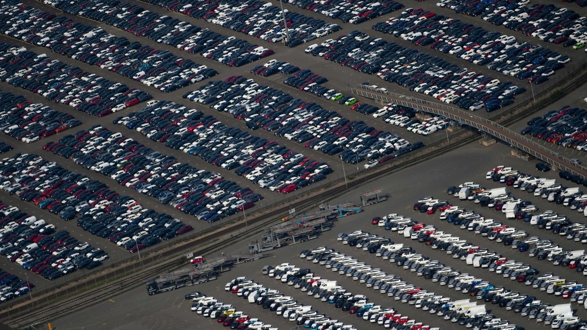 This aerial file photo shows new cars for sale parked at the harbor of Duisburg, western Germany, May 8, 2020. (AFP File Photo)