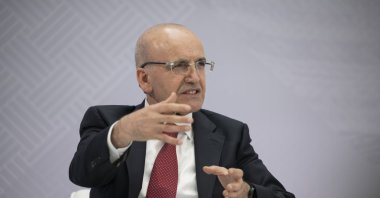 Treasury and Finance Minister Mehmet Şimşek speaks at a panel on the sidelines of the IMF-World Bank Spring Meetings, Washington, U.S., April 17, 2026. (AA Photo)