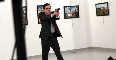 Mevlüt Mert Altıntaş, an off-duty policeman, shouts after shooting Andrei Karlov, the Russian ambassador to Türkiye, at an art gallery, Ankara, Türkiye, Dec. 19, 2016. (AP Photo)