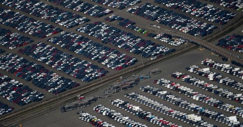 This aerial file photo shows new cars for sale parked at the harbor of Duisburg, western Germany, May 8, 2020. (AFP File Photo)