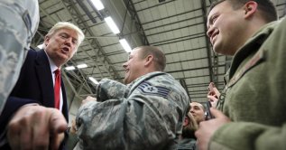 U.S. President Donald Trump gestures as he visits U.S. troops at Ramstein Air Force Base, Germany, Dec. 27, 2018. (Reuters Photo)