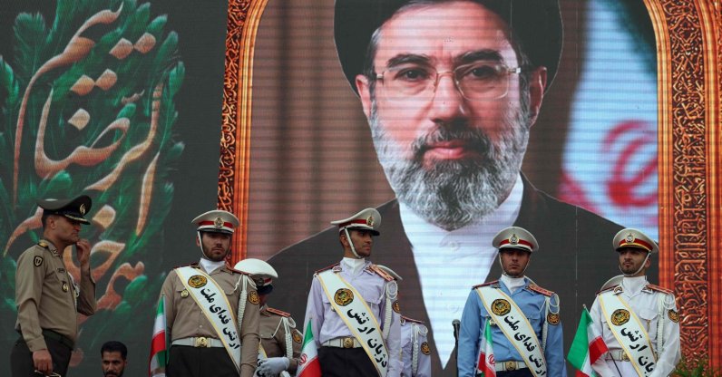 Iranian army soldiers stand in front of a picture of Iran's supreme leader Ayatollah Mojataba Khamenei during a rally to show their solidarity and support to the new Iranian supreme leader Ayatollah Mojataba Khamenei in Tehran, Iran, April 29, 2026. (AFP Photo)