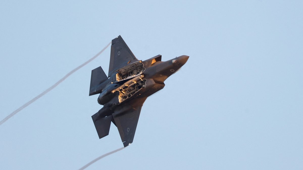 A F-35 fighter jet flies with weapon bay doors open during a graduation ceremony for Israeli Air Force pilots at Hatzerim Airbase, southern Israel, June 29, 2023. (Reuters Photo)