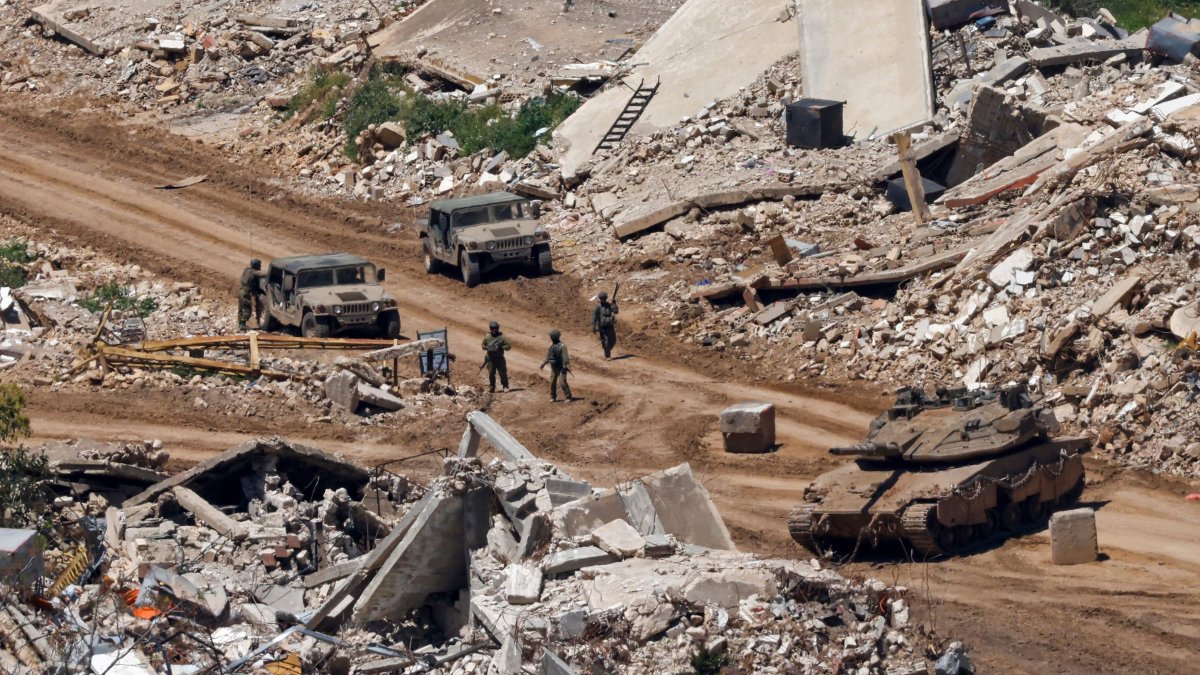 Invading Israeli troops and military vehicles are seen among destroyed houses in southern Lebanon, April 29, 2026. (AFP Photo)