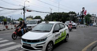 This photograph shows passengers riding an electric inDrive taxi along a street, Kathmandu, Nepal, April 29, 2026. (AFP Photo)