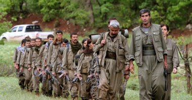 A group of PKK terrorists walk in Heror, northern Iraq, May 14, 2013. (AP Photo) 