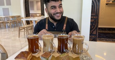 Franchisee Ahmad Badr serves a drink and treat sampler at Arwa Yemeni Coffee, California, U.S.,  April 6, 2026. (AP Photo)