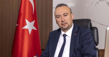 An undated photo of Özkan Yalım in his office, Uşak, western Türkiye. (DHA Photo)