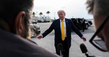 U.S. President Donald Trump speaks to journalists before boarding Air Force One at Palm Beach International Airport, in Palm Beach, Florida, U.S., May 2, 2026. (AFP Photo)