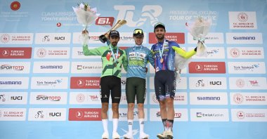 Overall winner of the 61st Presidential Cycling Tour of Türkiye, Sebastian Berwick (C), poses on the podium with second Ivan Ramiro Sosa and Kamiel Bonneu, in Ankara, Türkiye, May 2, 2026. (AA Photo)
