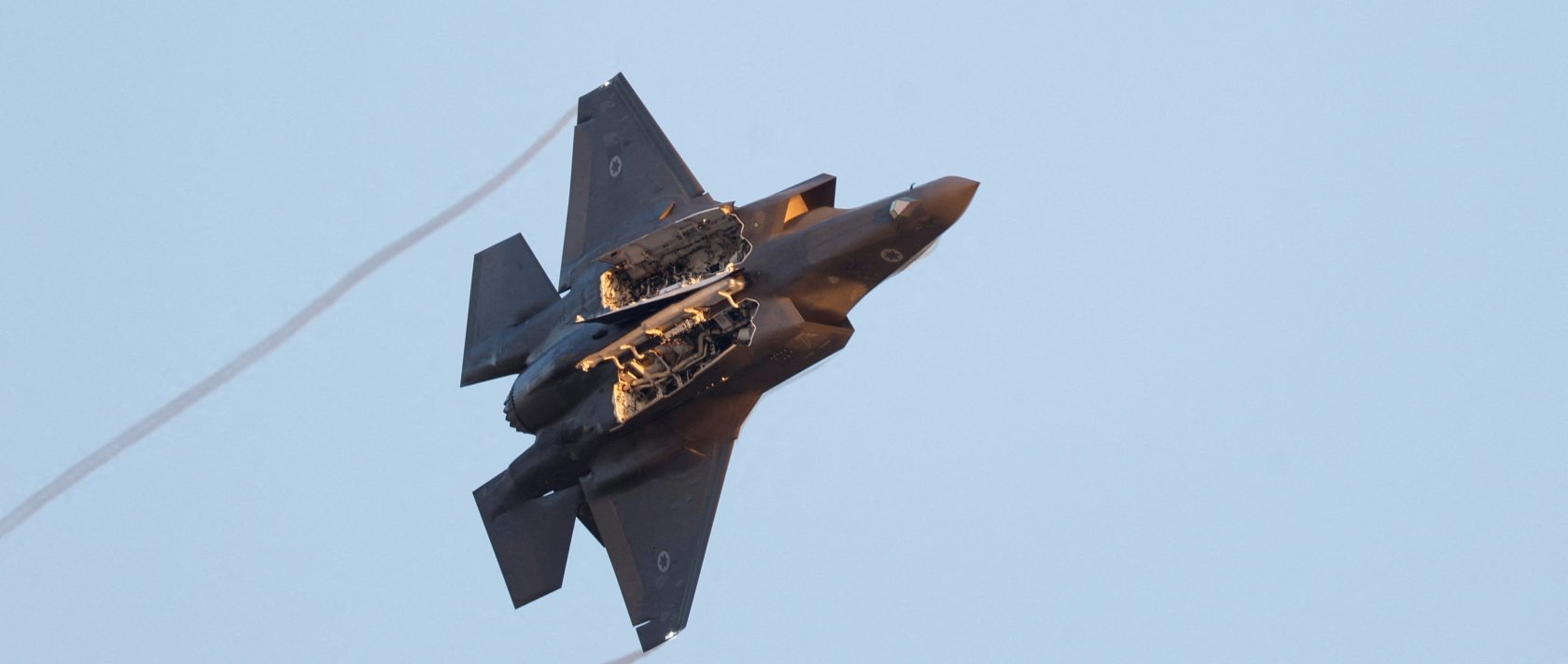 A F-35 fighter jet flies with weapon bay doors open during a graduation ceremony for Israeli Air Force pilots at Hatzerim Airbase, southern Israel, June 29, 2023. (Reuters Photo)