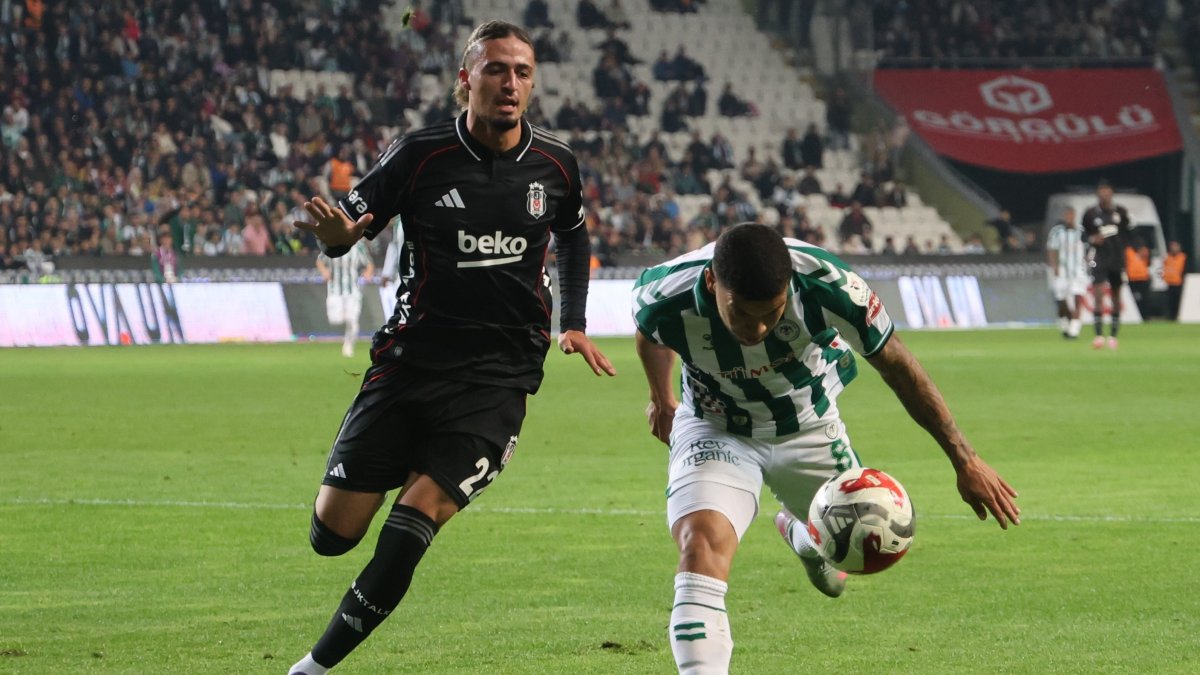Beşiktaş's Taylan Bulut (L) in action with Konyaspor's Pedrinho during the Süper Lig match at the Konya Büyüksehir Belediyesi Stadium, Konya, Türkiye, Oct. 22, 2025. (IHA Photo)