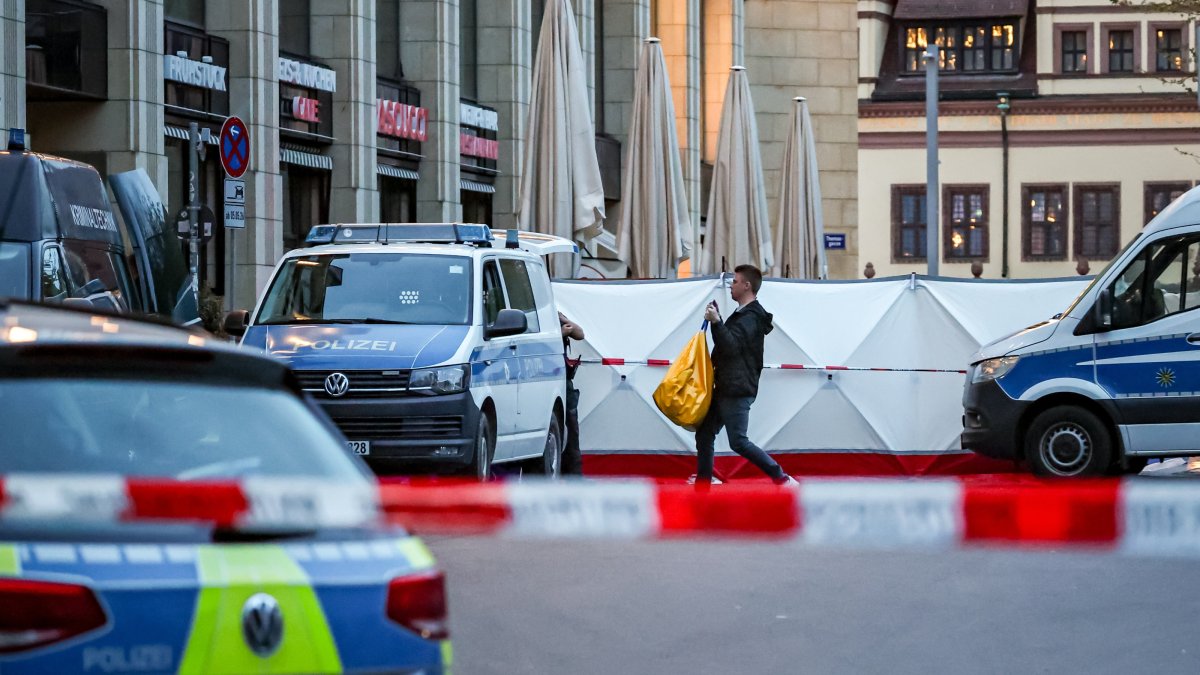 An investigator works at the scene after at least two people were killed and several others injured when a car drove into a crowd in a pedestrian zone in Leipzig, Germany, May 4, 2026. (EPA Photo)