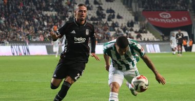 Beşiktaş's Taylan Bulut (L) in action with Konyaspor's Pedrinho during the Süper Lig match at the Konya Büyüksehir Belediyesi Stadium, Konya, Türkiye, Oct. 22, 2025. (IHA Photo)