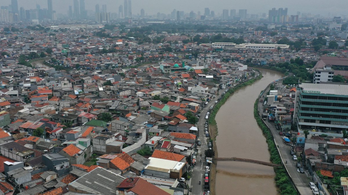 An aerial photo taken with a drone shows a densely populated residential area with high‑rise buildings in the background, Jakarta, Indonesia, May 5, 2026. (EPA Photo)