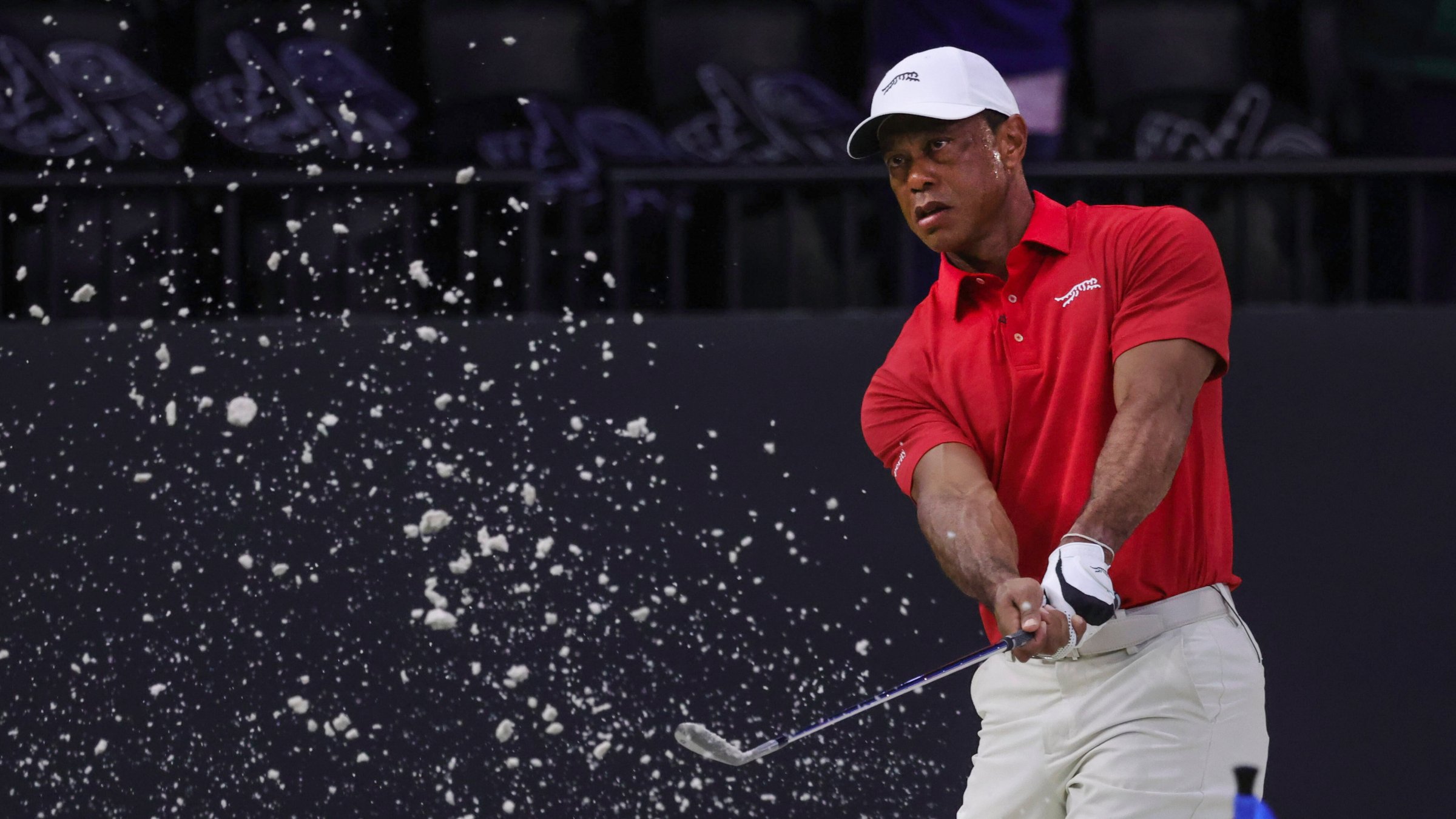 Tiger Woods of the Jupiter Links Golf Club makes a practice shot before the match, Palm Beach Gardens, U.S., March 24, 2026. (AP Photo)