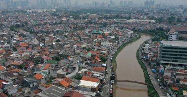 An aerial photo taken with a drone shows a densely populated residential area with high‑rise buildings in the background, Jakarta, Indonesia, May 5, 2026. (EPA Photo)