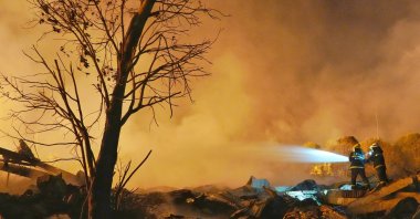 Firefighters work to extinguish a fire following a blast at a fireworks manufacturing factory in Liuyang, Hunan province, China, May 5, 2026. (Reuters Photo)