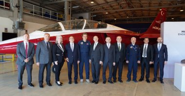 Turkish Aerospace Industries and GE Aerospace officials pose for a photo with the Hürjet aircraft in the background, Istanbul, Türkiye, May 5, 2026. (AA Photo)