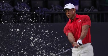 Tiger Woods of the Jupiter Links Golf Club makes a practice shot before the match, Palm Beach Gardens, U.S., March 24, 2026. (AP Photo)