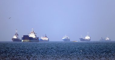 Vessels are pictured anchored in the Strait of Hormuz off Bandar Abbas in southern Iran, May 4, 2026. (AFP via Isna)
