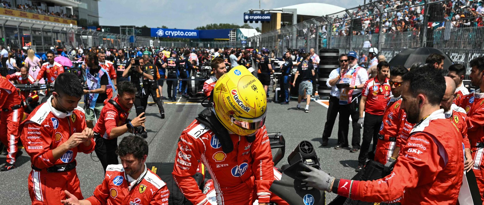 Ferrari's British driver Lewis Hamilton gets into his car at the starting grid before the start of the 2026 Miami Formula One Sprint at Miami International Autodrome, Miami Gardens, May 2, 2026. (AFP Photo)
