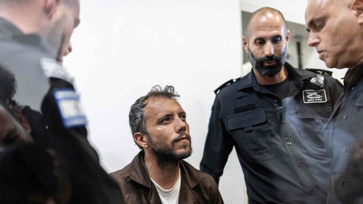 Brazilian activist Thiago Avila is escorted into a court in the city of Ashkelon, Israel, May 5, 2026. (AFP Photo)