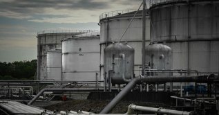 This photograph shows fuel storage tanks at a petroleum depot in Ambes, near Bordeaux, France, May 5, 2026. (AFP Photo)