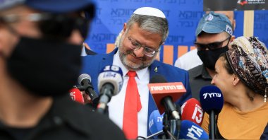 Israeli National Security Minister Itamar Ben-Gvir (C) and his wife Ayala Ben-Gvir react on the day the Supreme Court hears a petition seeking to force Prime Minister Benjamin Netanyahu to oust Ben-Gvir, west Jerusalem, Israel, April 15, 2026. (Reuters Photo)