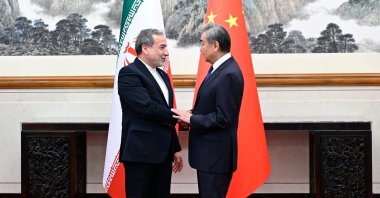 Chinese Foreign Minister Wang Yi and Iranian Foreign Minister Abbas Araqchi shake hands in Beijing, China, May 6, 2026. (Reuters Photo)