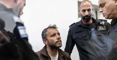 Brazilian activist Thiago Avila is escorted into a court in the city of Ashkelon, Israel, May 5, 2026. (AFP Photo)