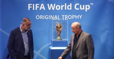 President of Iran Football Federation Mehdi Taj and Mayor of Tehran Alireza Zakani stand next to the FIFA World Cup Trophy during an unveiling ceremony, Tehran, Iran, Sept. 1, 2022. (Reuters Photo)