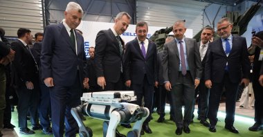From L-R, Trade Minister Ömer Bolat, Presidency of Defense Industries (SSB) head Haluk Görgün and Vice President Cevdet Yılmaz are seen alongside SAHA Istanbul Chairperson and CEO of defense manufacturer Baykar, Haluk Bayraktar, and other visitors during the SAHA 2026 defense fair, Istanbul, Türkiye, May 6, 2026. (AA Photo)