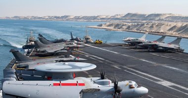 A handout picture released by the French Navy shows the flight deck of the French Navy's flagship aircraft carrier Charles de Gaulle transiting the Suez Canal en route to the southern Red Sea to pre-position for a possible mission to restore navigation in the Strait of Hormuz, May 6, 2026. (AFP Photo)