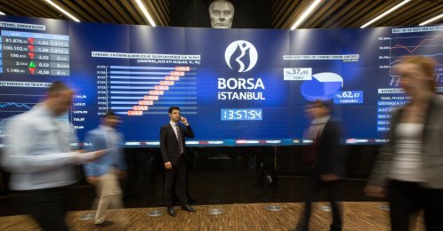 A general view of people moving in front of the Borsa Istanbul stock exchange sign in this file photo, Istanbul, Türkiye. (IHA Photo)
