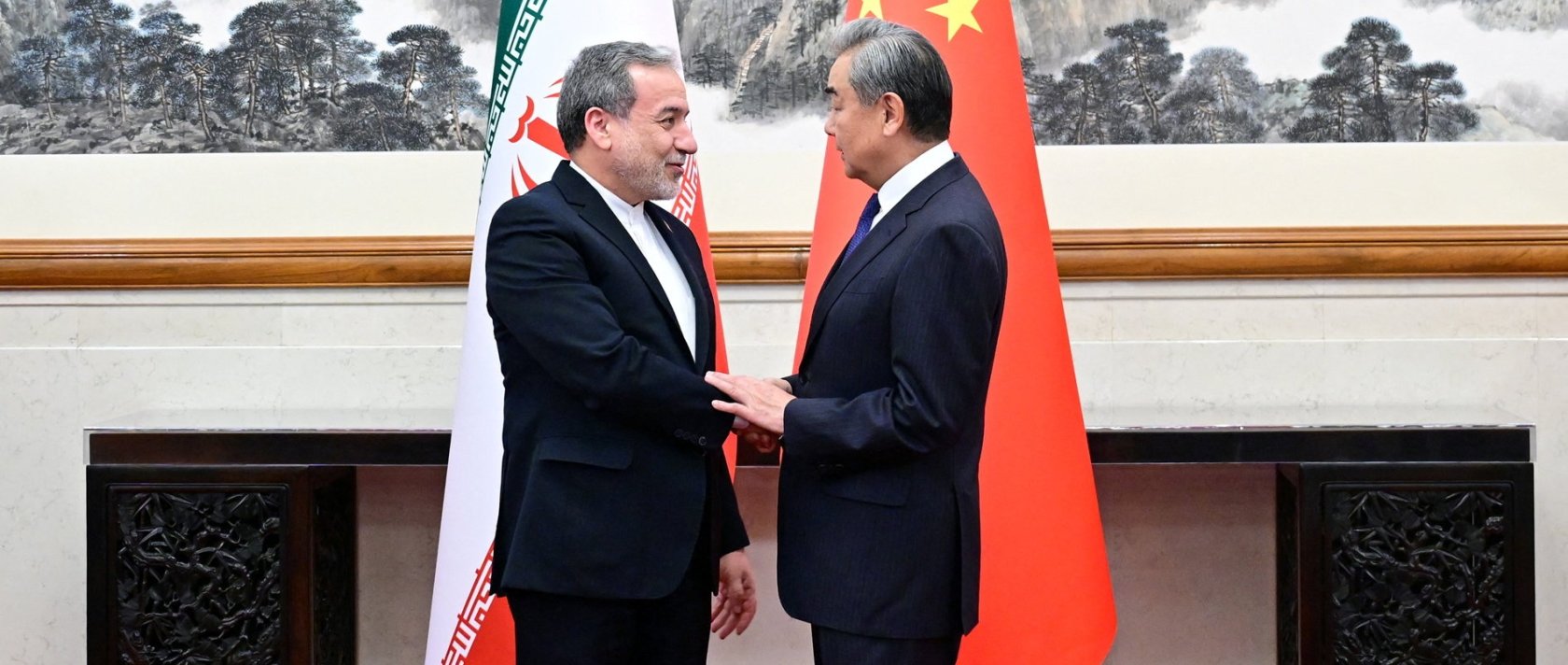 Chinese Foreign Minister Wang Yi and Iranian Foreign Minister Abbas Araqchi shake hands in Beijing, China, May 6, 2026. (Reuters Photo)