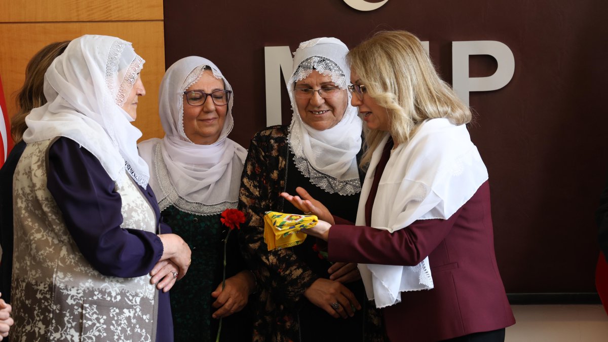 MHP's Filiz Kılıç (R) presents scarves as a gift to the Peace Mothers, Ankara, Türkiye, May 7, 2026. (DHA Photo)