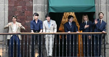 South Korean K-pop band BTS acknowledges fans from the balcony of the National Palace, at Zocalo square in Mexico City, Mexico, May 6, 2026. (AFP Photo)